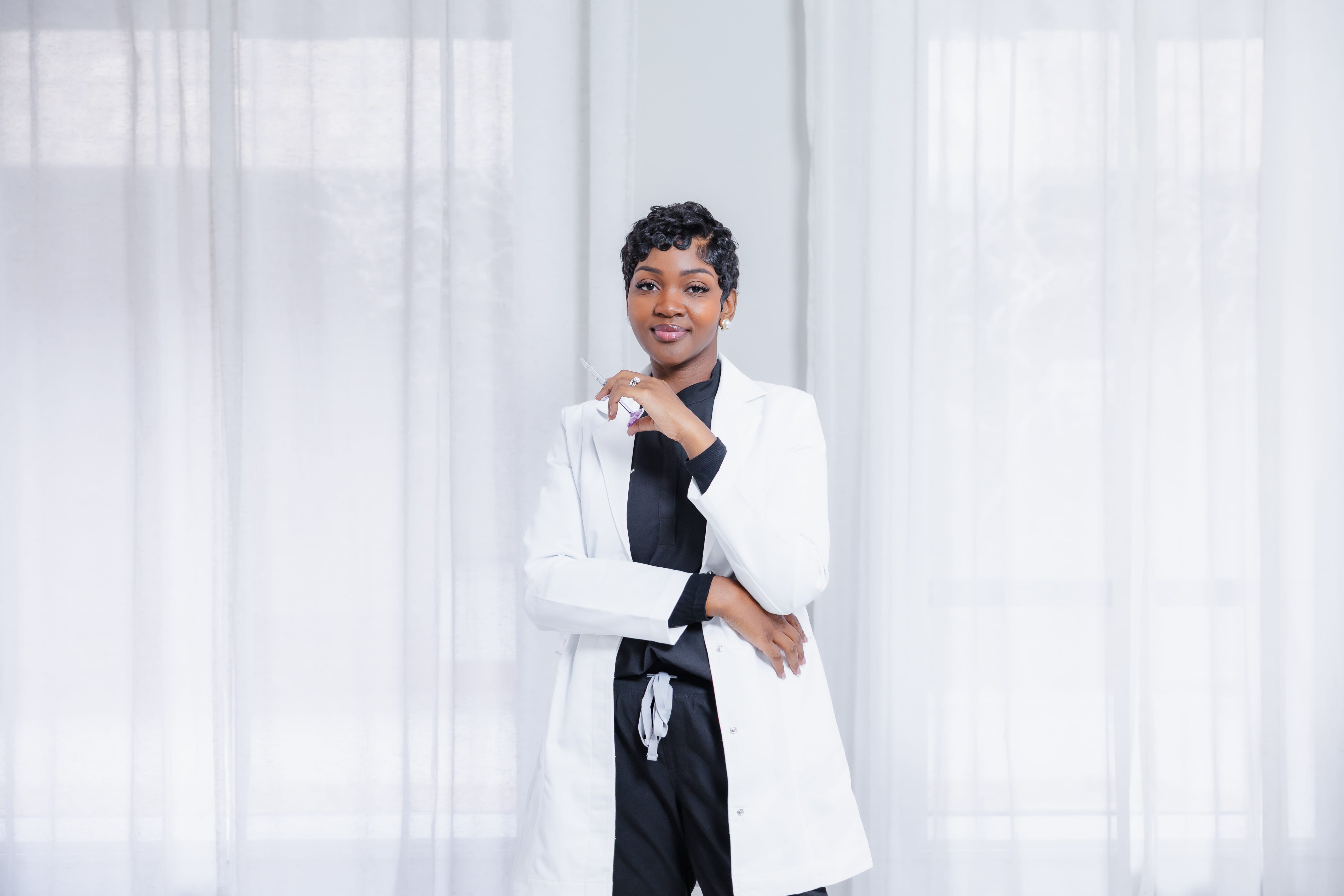 Cleo R. standing confidently in her white coat